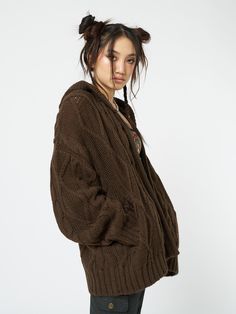 Shop this cable knit hood cardigan in brown. With an oversized fit, zip fastening, drawstring hood, drop shoulders and ribbed trims. Featuring long sleeves, acrylic and wool blend. Model wears size M and is 180 cm | 5'11" tall. Eli Brown, Minga London, Brown Zip Ups, Chill Outfits, Knitted Hood, Hooded Cardigan, Cable Knit Cardigan, Best Wear, Y2k Style