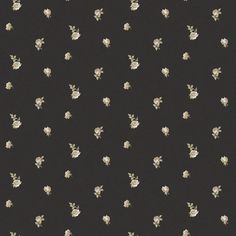 a black and gold wallpaper with small white flowers on it's side,