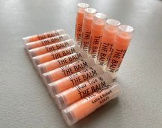 "Handmade Orange MIMOSA Sweetened Flavored Personalized Lip Balms in Clear Tubes with Clear Labels! Fast Shipping  The wording can say anything you like. - Handmade Mimosa Flavored Lip Balms - Personalize with Your Wording on them with Clear Labels Adhered Already - Peanut, Gluten, Dairy, Tree Nut and Paraben Free - Lip Balm is Tinted Orange Color and Comes in Round .15oz Clear Tubes with Clear Caps. Will Apply Clear on the Lips. - Tubes are MADE IN THE USA and are BPA Free ❤ Made Fresh When Your Order is Placed and Will Ship Within 1-3 Business Days. ❤ ➽ In a RUSH? You can use this listing to Jump the Line and get your order out the door faster than our regular processing time. Simply add this listing to your cart when ordering. https://www.etsy.com/listing/1295585879/rush-my-order-jump-t Lip Balm Party Favors, Orange Mimosa, Personalized Lip Balm, Clear Labels, Flavored Lip Balm, Peanut Free, Lip Balms, Lip Balm Gloss, Say Anything