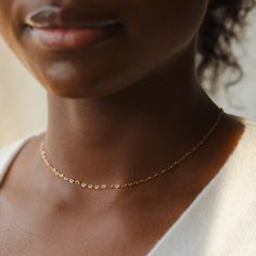 "Add a little love to your everyday stack with the sweetest heart choker--a romantic take on the classic paperclip chain! Seriously, these hearts are teeny (like a little secret from you to you). Every piece is handcrafted and hand-personalized with love in La Conner, WA, using 90% recycled and 100% ethically sourced raw materials from the USA--because it's better that way. Includes free gift-ready packaging (featuring a care card and traditional letterpress goodies made by my dad)!  MATERIALS: * Gold = 14k gold filled * Silver = sterling silver DETAILS: * 1.8mm wide chain * Adjustable by 2\" AT CHECKOUT: * If you chose \"other\" for length, specify which length you'd like in a note. * Select expedited shipping (and add a note with your ideal delivery date) if you need your piece sooner th Dainty Paperclip Chain Necklace For Valentine's Day, Dainty Paperclip Chain Necklace For Anniversary, Dainty Anniversary Necklace With Paperclip Chain, Minimalist Chain Necklace For Valentine's Day, Minimalist Delicate Chain Necklace For Valentine's Day, Elegant Gold Choker With Heart Charm, Adjustable Gold Choker With Heart Charm, Adjustable Gold Heart Choker, Adjustable Heart-shaped Metal Choker