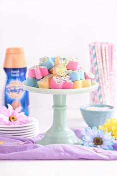 a table topped with lots of colorful desserts