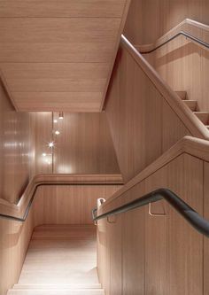 the inside of a wooden building with stairs