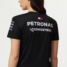 a woman wearing a black t - shirt with the words petrols on it