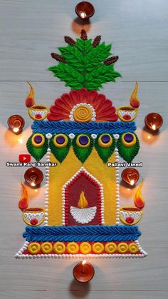 a decorated wall hanging with candles and decorations