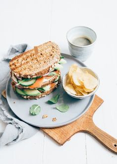 a sandwich and some chips on a plate