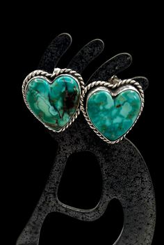 Signed Tommy Navajo Sterling Silver Natural Turquoise Heart Stud Earrings Orders totaling $100 and up include an anti-tarnish treated velvet jewelry pouch!  Earrings measure approximately 1" X 7/8" Weight is approximately 14 grams Condition: Pre-owned Metal: Sterling Silver Signed Tommy, electronically tested with a Niton DXL precious metal analyzer to guarantee sterling silver Comes in a gift box  Items in used condition will exhibit the expected surface scratches and dings to the silver from normal wear. Take a look at our other earrings  https://www.etsy.com/shop/OnceUponAGemJewelers/items?section_id=21340767 Or visit our store to see all our treasures! https://www.etsy.com/shop/OnceUponAGemJewelers?ref=seller-platform-mcnav Items ship in 1-3 business days. If you need it sooner rather Handmade Western Turquoise Earrings, Turquoise Heart-shaped Sterling Silver Earrings, Turquoise Heart Earrings, Navajo Earrings, Velvet Jewelry, Turquoise Heart, Earrings Heart, Earrings Turquoise, Heart Stud Earrings