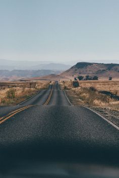 an empty road in the middle of nowhere