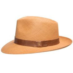 A man of mystery and undeniable style. Designed to help you keep your cool in any situation, with a padded comfort sweatband of exceptional breathability. Made of straw and is the color of toasted wheat, finely handwoven in Ecuador, and completed in the USA with a deep mocha leather hatband. Summer discoveries are waiting. Grab your hat, and get started. Material: 100% Toquilla StrawBrim: 2 3/8"Crown: 4 1/2" teardropClimate: Sun Handwoven in Ecuador. Hand-finished in the US. Measurements are app Fitted Brown Toquilla Straw Hat, Classic Brown Panama Hat For Outdoor, Classic Brown Straw Hat With Short Brim, Classic Brown Straw Hat For Summer, Fitted Brown Casual Straw Hat, Fitted Brown Straw Hat Casual, Fitted Casual Brown Straw Hat, Classic Woven Adjustable Panama Hat, Classic Brown Toquilla Straw Hats