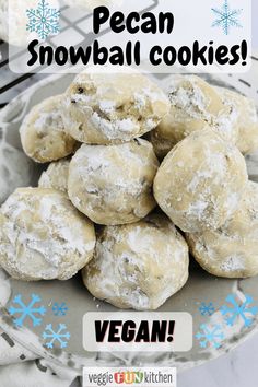 a pile of vegan snowball cookies sitting on top of a plate with the words vegan written above it