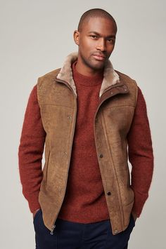 For a shearling vest that you can wear almost every day of the year, our Trailblazer fits the bill. On the coldest days, layer this hard worker with a thermal knit underneath your favorite winter coat on top. But when you just need a little extra warmth on a brisk, sunny day, pair it with your favorite shirt and take it out for a spin on a winding country road or a bustling city street. Oval Body Shape, Sheepskin Vest, Guy Gifts, Mens Smart Casual Outfits, Vest For Men, Coats For Men, Shearling Vest, Guys Clothing Styles, Sheepskin Coat