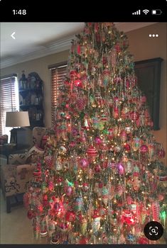 a christmas tree is decorated with ornaments and lights