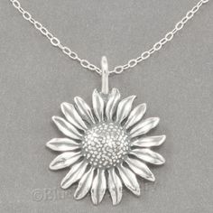 FlowerNecklace in. 925 Sterling Silver. pendant is 2.9 gr 1" x 7/8". You can request a 16" or 20" chain. Silver Sunflower Pendant Jewelry, Silver Jewelry With Sunflower Design Flower Pendant, Silver Sunflower Pendant Necklace, Silver Sunflower Design Flower Necklace, Silver Sunflower Design Necklace, Silver Necklace With Sunflower Pendant, Silver Jewelry With Sunflower Design, Sunflower Charm, Pretty Jewelry Necklaces