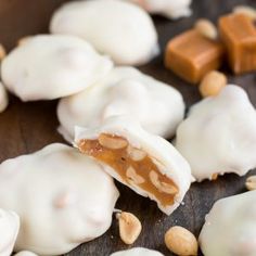 some kind of food that is on top of a wooden table with nuts and almonds