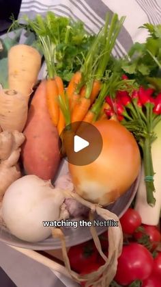 a bowl filled with lots of different types of veggies next to each other