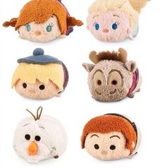 several small stuffed animals with different faces on them