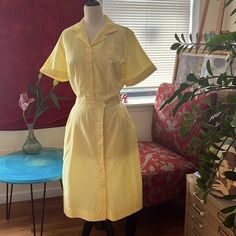 Label: White Swam Uniforms Most Likely Waitress Uniform Dress Size: 8-10 1950s Style: This Dress Has Short Sleeves That Can Be Rolled Up, A Half Button Placket Entry At The Center Front With A Bermuda Collar And A Self Fabric Belt Buckle Belt Color: Yellow Fabric: Poly/Cotton Blend Front Approximate Dimensions: Chest 42”, Waist 32”Hips 48”, Skirt Length: 25” +Hem 2” Condition: Excellent Vintage Condition Cute Yellow Church Dress, 40s Womens Yellow Dress, Waitress Uniform, Pleated Halter Dress, Feather Gown, Lacey Dress, Classic Shirt Dress, Olive Dress, Uniform Dress