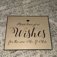 a sign that says please leave your wishes for the new mr and mrs