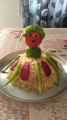 a cake made to look like a vegetable on top of rice