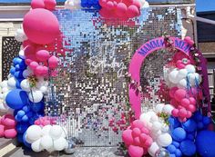 an entrance decorated with balloons and streamers