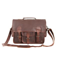 Materials: 100% full grain leather exterior. 100% cotton lining interior. Dimensions: 15L capacity. W41cm x H30cm x D12cm, top handle: L23cm W3cm, extendable shoulder strap: L78cm-L145cm. Hardware: Brass fittings and YKK zippers. Features: 15″ laptop capacity, extendable detachable shoulder strap, top handle, front external pocket, two side external pockets, back zip pocket, two internal compartments, internal zip pocket, zip and buckle fastening to the main compartment. The Harvard Satchel in o Leather Satchel With Adjustable Strap For Work, Classic Satchel Camera Bag With Adjustable Strap, Leather Flap Satchel For Everyday, Everyday Leather Flap Satchel, Classic Brown Camera Bag With Adjustable Strap, Leather Saddle Bag With Leather Handles For Work, Classic Saddle Bag With Leather Handles, Leather Satchel With Adjustable Strap, Classic Saddle Bag Tote With Leather Handles