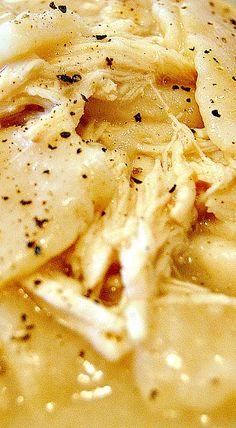 a close up view of some food in a bowl with gravy on it