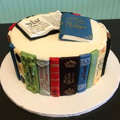 a cake decorated with books on top of it