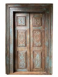 an old wooden door with intricate carvings on it