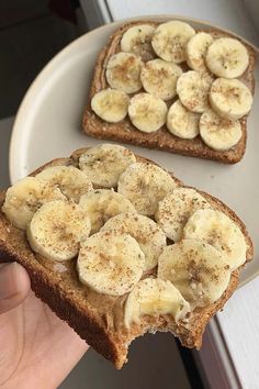 two slices of bread with bananas on them