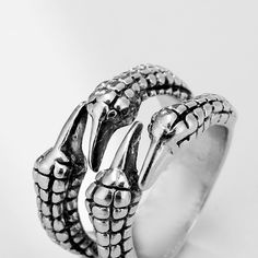 Inspire your style with this unique and stylish dragon claw ring. Crafted from quality metals and designed with a statement-making style, it's the ideal accessory for dragon lovers, gothic steampunk fans, or anyone who appreciates personality jewelry. An excellent gift for anyone, make it a gift for him or a self-gift. Overview: 100% new design and high quality Must-have for fashion women Have a beautiful appearance Specifications: Material: Alloy Style: European and American Modeling: geometric Gothic Claw Shaped Metal Rings, Unique Claw-shaped Metal Rings, Unique Claw Shaped Metal Rings, Silver Punk Claw Rings, Dragon Claw, Claw Ring, Dragon Lover, Jewellery Rings, Ring Fashion