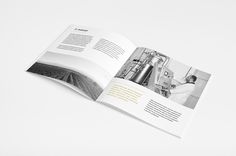 an open brochure is displayed on a white surface with black and white images