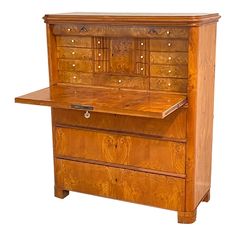 an old fashioned wooden desk with drawers