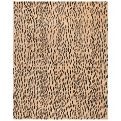 an animal print rug with black and tan spots on the bottom, in front of a white background