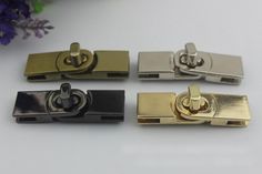 four different types of brass and black metal hinges on a white surface with flowers in the background