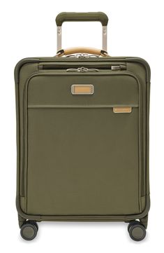 This spinner carry-on bag designed for easy packing and easy transport features multiple compartments and pockets for all types of wardrobe items.Closure: The zip-around closure features self-repairing YKK zippers with lockable double pulls, and an included TSA cable combination lock keeps your possessions extra secure.Exterior features: The ballistic-nylon exterior resists wear, moisture, dirt and abrasion, and proprietary shock-absorbing spinner wheels offer 360-degree movement and quiet glidi Functional On-the-go Luggage With Leather Trim, Modern Nylon Luggage With Zipper, Green Luggage With Sleeve For Business Trips, Travel Cases With Leather Trim, Versatile Green Luggage For Travel, Functional Rectangular Luggage With Leather Trim, Rectangular Travel Cases With Leather Trim, Functional Luggage With Zipper Closure For Business Trips, Functional Luggage With Zipper For Business Trips