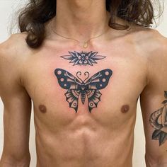 a man with a butterfly tattoo on his chest