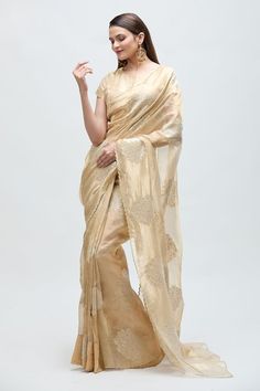 Gold tissue saree featuring floral zari embroidered buti work all over. Paired with a solid blouse. - Aza Fashions Fitted Raw Silk Saree With Resham Embroidery, Bollywood Style Raw Silk Pre-draped Saree With Resham Embroidery, Elegant Pre-draped Saree With Chikankari For Festive Occasions, Festive Embroidered Cotton Silk Pre-draped Saree, Resham Embroidered Raw Silk Blouse Piece For Reception, Raw Silk Blouse Piece With Resham Embroidery For Reception, Embroidered Chanderi Pre-draped Saree For Reception, Bollywood Style Silk Traditional Wear With Resham Embroidery, Bollywood Silk Saree For Reception