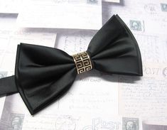 "Beautiful silk pre tied and adjustable double tiered banded bow tie. Will adjust from 13\" through 20\" neck. Bow dimensions 2.5\" x 4.5\"." Elegant Adjustable Tie For Black-tie Events, Elegant Adjustable Ties For Black-tie Events, Elegant Adjustable Black-tie Event Ties, Elegant Adjustable Accessories For Black Tie Events, Adjustable Gold Bow Tie For Black Tie Events, Elegant Adjustable Bow Tie For Black-tie Events, Classic Gold Adjustable Bow Tie, Classic Adjustable Gold Bow Tie, Adjustable Decorative Bow For Black-tie Events