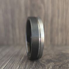 a wedding band that has been made to look like it is on top of a wooden table