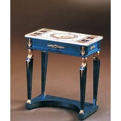 a small blue table with gold trimmings on the top and bottom, sitting in front of a brown background