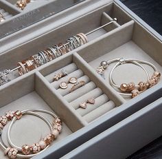 an open box containing jewelry and bracelets