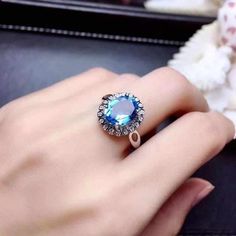 Welcome to Elegant Art Jewelry!  Stone: Natural Blue Topaz Stone Size:. 10mm×8mm Stone Cut:. Oval Cut Side Stone: Zircon Metal: 925 Sterling Silver Personalization: 9K/14K/24K/GOLD/SILVER/PLATINUM/ROSE-GOLD/WHITE GOLD. (Contact me)  Topaz Ring, Topaz Cuff Ring, 925 Sterling Silver Ring, Round Shape Ring, Topaz Ring, Topaz Engagement, Open Design Ring, Topaz Round, Topaz Natural, Blue Topaz, Blue Gemstone, Gemstone Ring, Engagement Ring, Wedding Ring, Statement Ring, Topaz Ring, Victorian Ring, T Topas Ring, Pink Topaz Ring, Luxury Ring, Oval Cut Ring, Victorian Ring, Gold Topaz, Platinum Rose Gold, Emerald Cut Rings, Topaz Engagement Ring