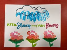 a child's drawing of flowers with the words, april showers bring may flowers