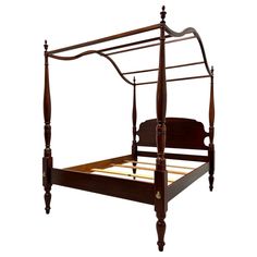 a wooden bed frame with four posts and no headboard or foot board on an isolated white background