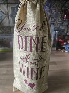 a wine bag with the words you can't dine without wine on it