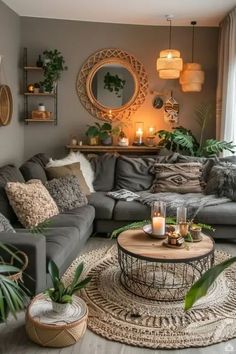 a living room filled with lots of furniture and candles on top of it's coffee table