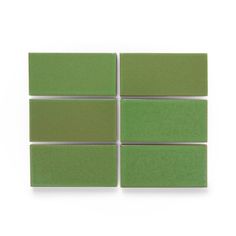 four square green tiles on a white background