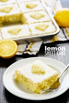 a slice of lemon sheet cake on a plate with a fork