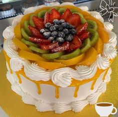 there is a cake with fruit on it