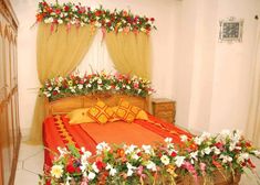 a bed with flowers on the head board