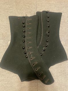 Pair of women's Tweedie boot tops of black wool with 14 side buttons on each.  These are small, probably around a size 5 or 6. I will send measurements if requested. VERY good condition for being over 100 years old, they look barely used, like they just came out of the box. Perfect for steampunk!  Charles Tweedie patented Tweedie Boot Tops in 1915 and 1918 and they were very popular in the 1920s. They were called a "boot top" - the term more pleasing than "spat" and were made and sold by the Tweedie Boot Top Company, St. Louis, Missouri. The company slogan was "a pair fitted is a pair sold". A label was sewed in every pair as a guarantee of quality and to discourage imitators. Vintage Fitted Corset For Fall, Vintage Fall Corset, 1920s Shoes, Victorian Boots, Clothing Reference, Boot Covers, Company Slogans, St Louis Missouri, Adult Costumes